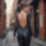 A fashionable individual wearing a backless unitard in an urban setting