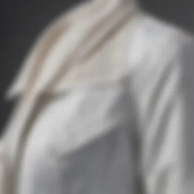 Close-up of fabric and details on a white jean jacket.