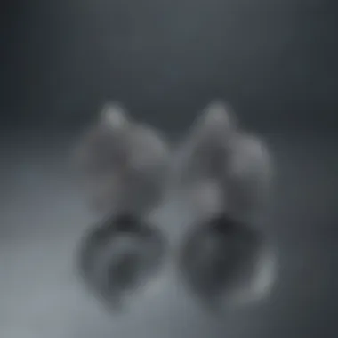 Titanium Spiral Earrings on Reflective Surface Titanium spiral earrings displayed on a reflective surface